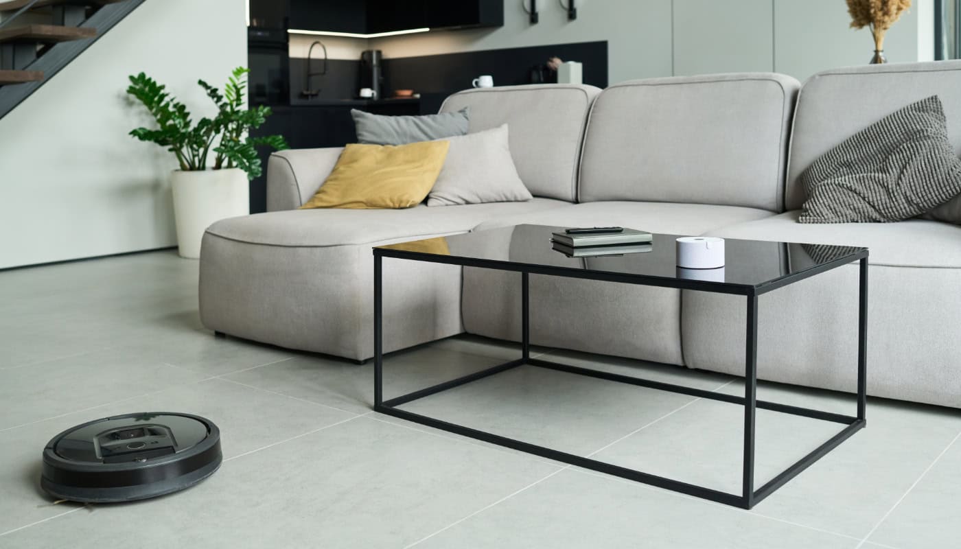 smart-robot-vacuum-cleaning-a-modern-living-room robotic vacuum winter cleaning